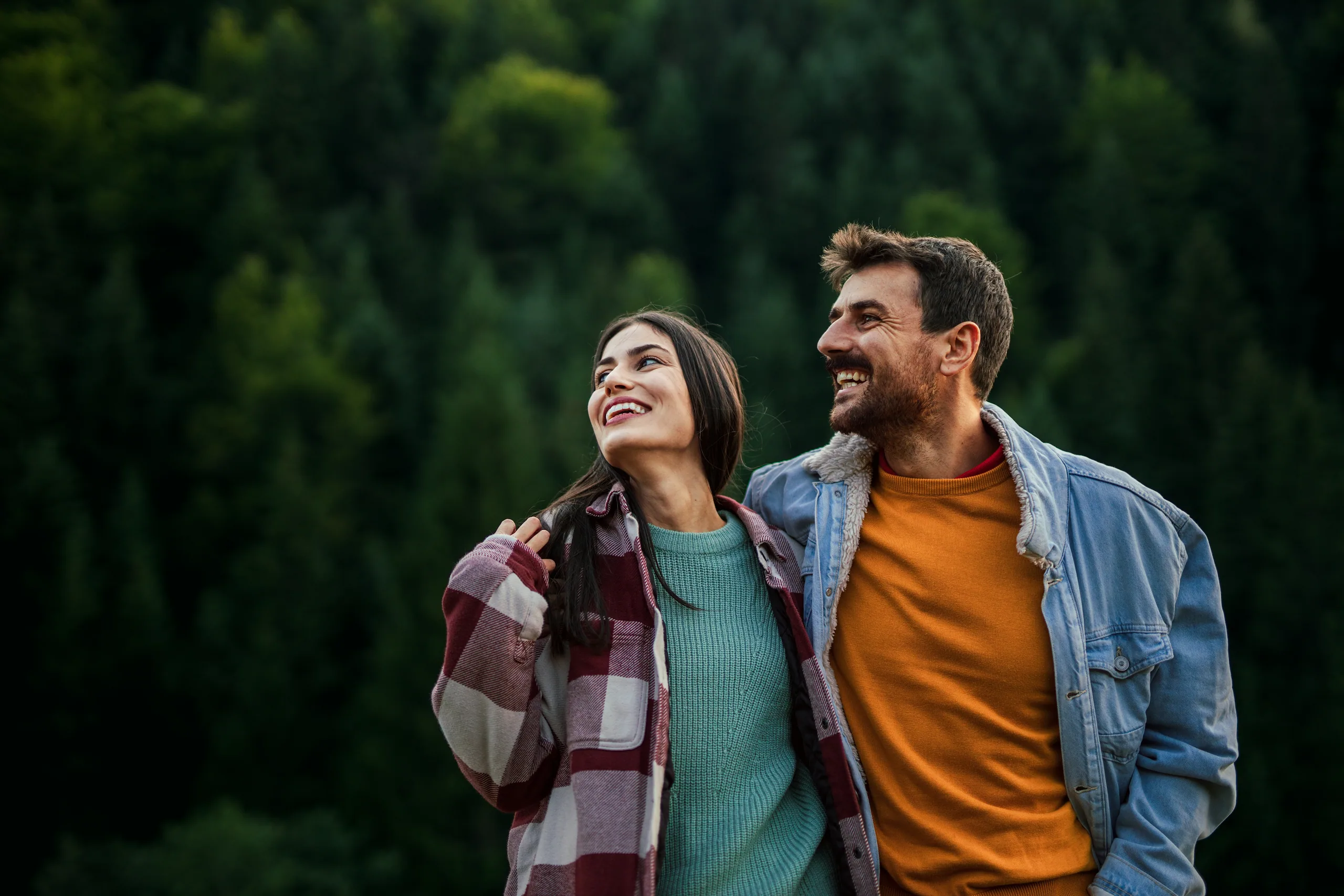 Couple smiling on a walk outdoors