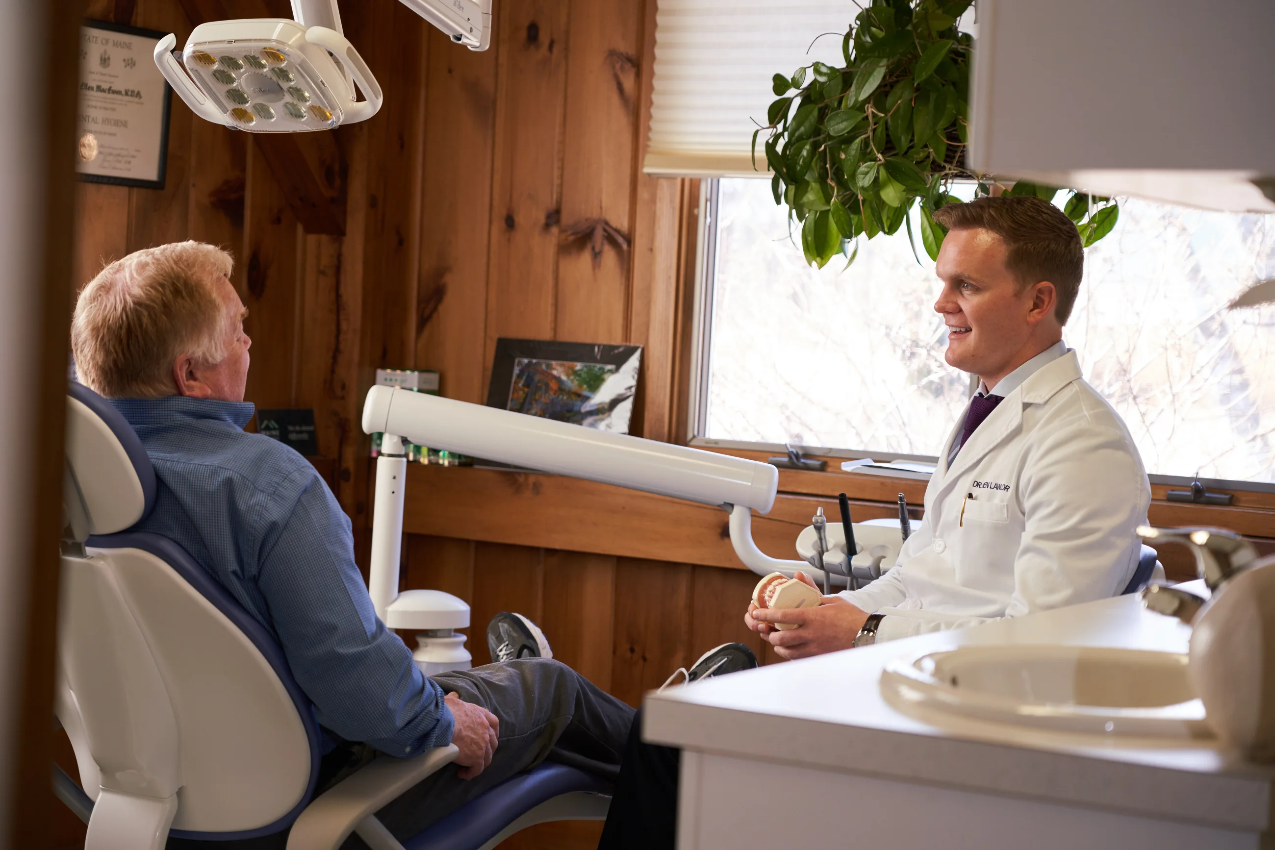 Dr. Benjamin Lawlor speaking with a patient during a consultation at Maine Dentistry