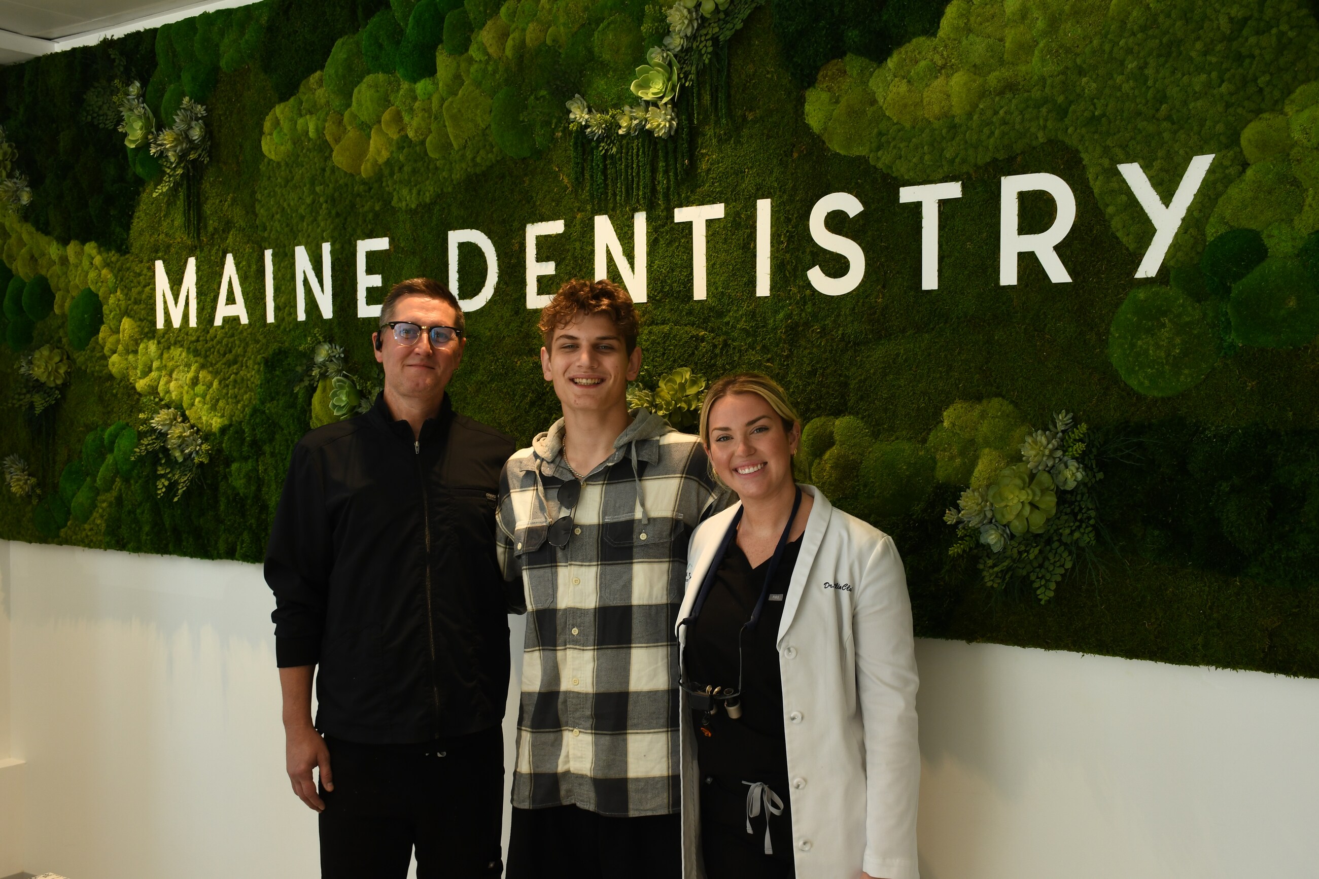 Maine Dentistry team with a patient at the Maine Dentistry office